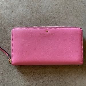 Pink Kate Spade zip-around wallet saffiano leather